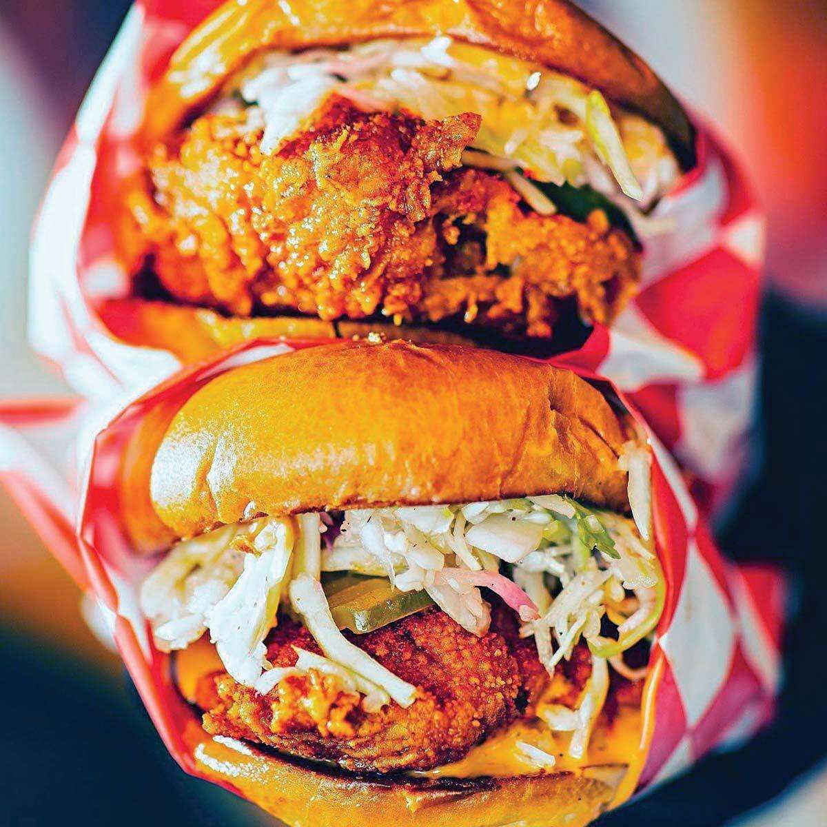 Birdcode's "sandos," with boneless breast meat, are built on brioche buns topped with vinegar slaw, pickles and mayonnaise-based "comeback sauce."