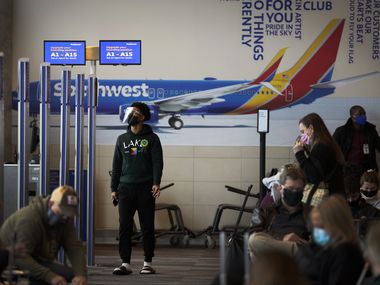 Passengers waited at Southwest Airlines gates inside the terminal at Dallas Love Field in January.