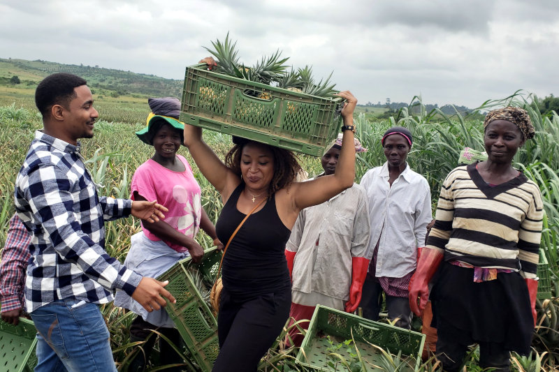 Ada Osakwe with pineapple farmers in Nigeria.