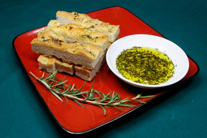Easy Rosemary Garlic Focaccia Bread is great served with an olive oil and herb dipping sauce.
